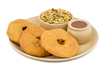 Indian Traditional Sweet Kachori Also Know As Mawa Kachori, Kachauri or Kachodi, Stuffed Kachori With Condensed Milk, Cheese and Dry Fruits And Served With Sugar Syrup isolated on White Background