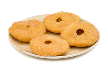 Indian Traditional Sweet Kachori Also Know As Mawa Kachori, Kachauri or Kachodi, Stuffed Kachori With Condensed Milk, Cheese and Dry Fruits And Served With Sugar Syrup isolated on White Background