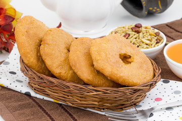 Indian Traditional Sweet Kachori Also Know As Mawa Kachori, Kachauri or Kachodi, Stuffed Kachori With Condensed Milk, Cheese and Dry Fruits And Served With Sugar Syrup