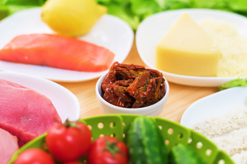 A close-up of the ingredients for the preparation of Caesar salad related to the kitchen. Home kitchen. Useful and tasty food