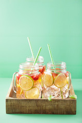 refreshing summer lemonade with strawberry and lime in mason jar