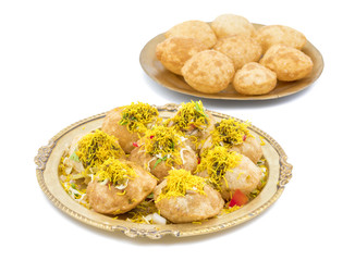 Indian Spicy Chaat Item Sev Puri Stuffed With Potato, Sev Namkeen, Coriander, Chutney isolated on White Background. It is a Most Popular Snack of Mumbai, Maharashtra