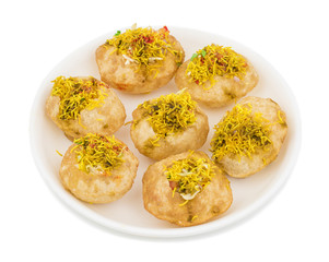 Indian Spicy Chaat Item Sev Puri Stuffed With Potato, Sev Namkeen, Coriander, Chutney isolated on White Background. It is a Most Popular Snack of Mumbai, Maharashtra