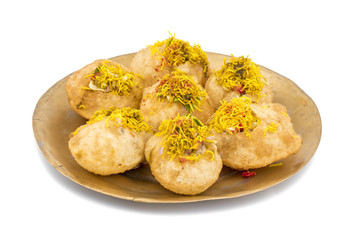 Indian Spicy Chaat Item Sev Puri Stuffed With Potato, Sev Namkeen, Coriander, Chutney isolated on White Background. It is a Most Popular Snack of Mumbai, Maharashtra