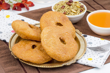 Indian Traditional Sweet Kachori Also Know As Mawa Kachori, Kachauri or Kachodi, Stuffed Kachori With Condensed Milk, Cheese and Dry Fruits And Served With Sugar Syrup