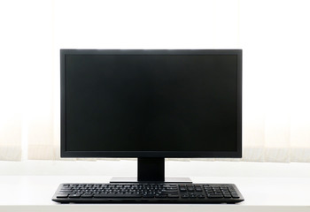 computer screen PC and White Coffee Cup for business on the table