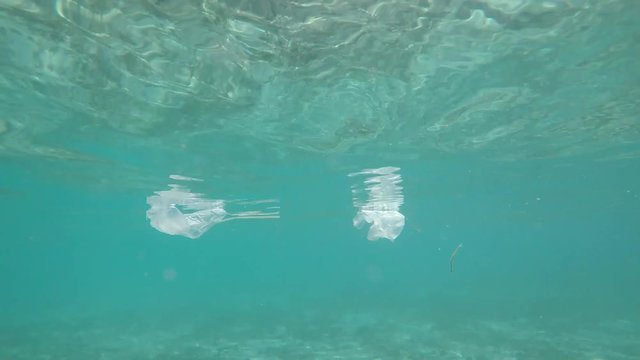Plastic bags and bottles pollution in ocean