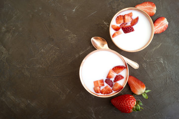 Homemade natural yogurt with strawberries and muesli.