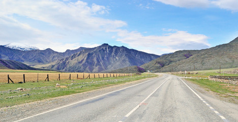 Naklejka premium landscape with an automobile road in a mountainous area