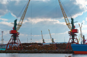 Seaport on the Baltic sea. Сommercial port. Port cranes and machinery.