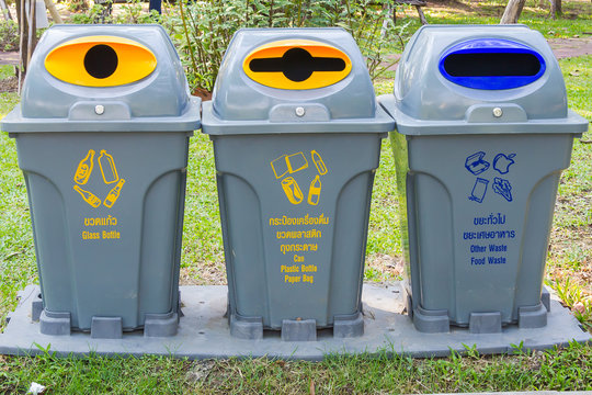 Plastic bin with text in the garden
