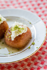 Turkish Traditional Dessert Kemalpasha, Shekerpare with Cream on Top