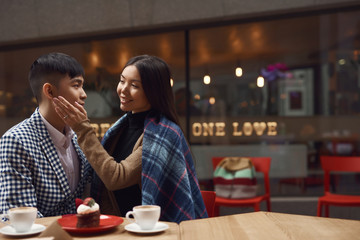Happy couple in a cafe.