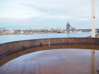 top of a barrel filled with water with the cologne dome in the background, Germany