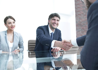 Business people finish the meeting with a handshake