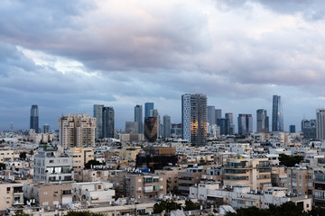 Fototapeta na wymiar clouds over the skyscrapers Tel Aviv Israel. sunset