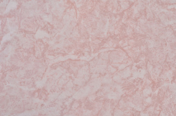 A tile, a pattern on a pink ceramic tile, a texture.