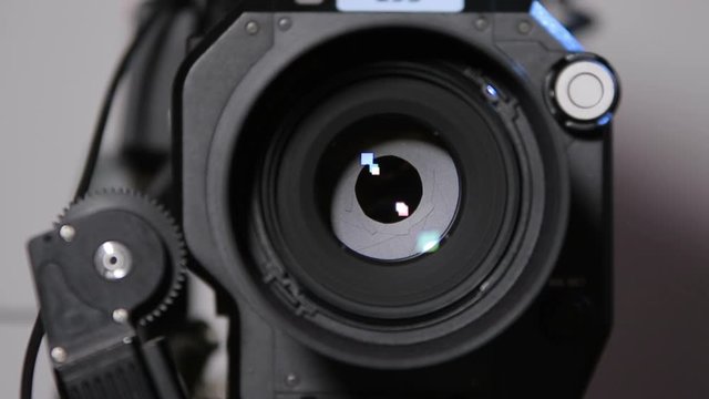 Diaphragm (iris) closing in a camcorder front view close-up with 50mm lens (1080p, 25fps)