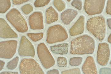 Fototapeta premium The texture is a ceramic tile of mosaic of round stones.