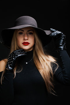 Photo of young blonde in hat , gloves