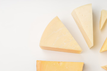 Different types of cheese on white background