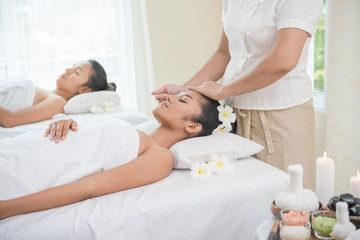 Fototapeta na wymiar young woman getting spa treatment at beauty salon. spa face massage. facial beauty treatment. spa salon.