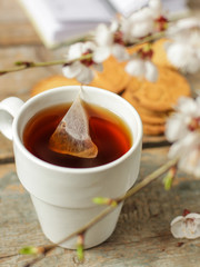 tea in a cup is brewed with a tea bag (meal outdoors) - cuisine.  Food background