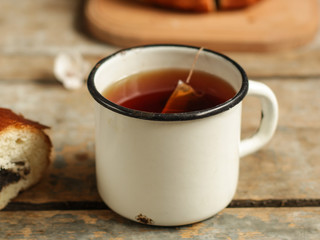 tea in a cup is brewed with a tea bag (meal outdoors) - cuisine.  Food background
