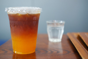 Glass of coffee with orange soda