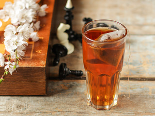 tea in a cup is brewed with a tea bag (meal outdoors) - cuisine.  Food background