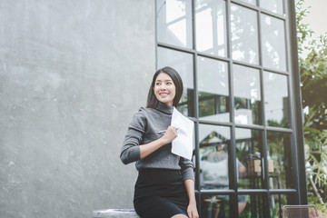 Modern business woman in the office with copy space, smiling business woman. Middle age beautiful...