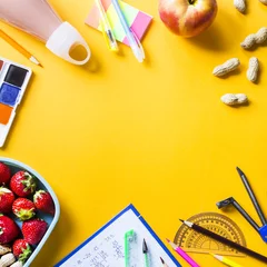 Photo sur Plexiglas Gamme de produits School supplies of the child and lunch in plastic boxes on a yellow background. Healthy food for a child to take to school concept. Copyspace. Top view, flat lay