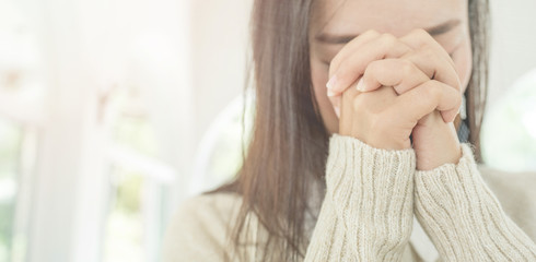 woman hands praying to god with the bible.