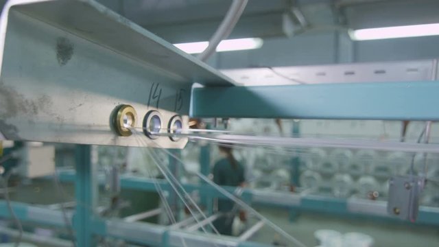 macro fiberglass stretches through holes at plant