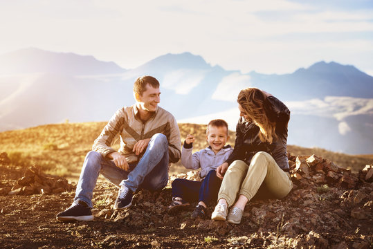 Happy family sunset mountains area travel concept