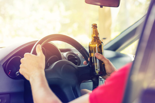 drinking beer while driving a car