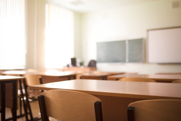 School classroom in blur background without young student; Blurry view of class room no kid or...