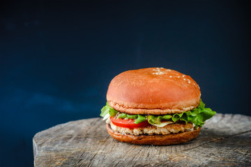 Appetizing homemade burger on a wooden table