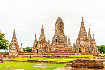 Fototapeta premium Old pagodas (or chedi) in ancient UNESCO World Heritage city, Ayuddhaya, in Thailand under cloudy sky