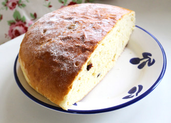 Typical festive Easter Czech sweet bread called mazanec,food concept.Top view, copy space, selective focus. Pastries on a wooden table. Blurred background. Concept of fresh pastry.