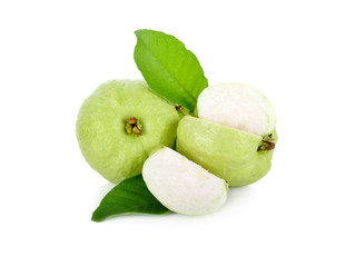 whole and cut fresh guava with leaves on white background