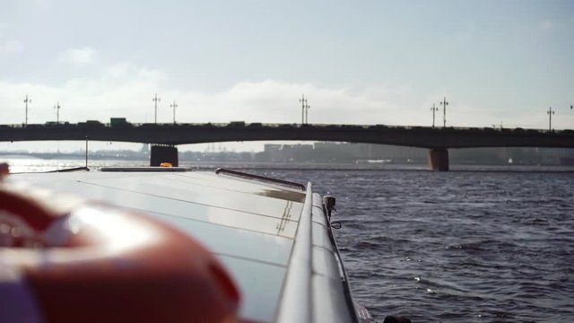 Passenger ship sailing in a city river at sunny day