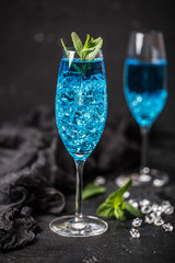 Cocktail glass with the Blue Hawaii. Blue hawaiian alcoholic cocktail