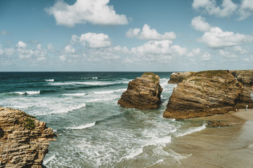 Fototapeta na wymiar Beach of the cathedrals with large stones of Ribadeo, Spain