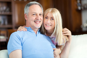 Mature couple relaxing at home