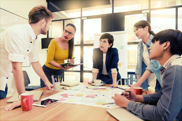 Fototapeta premium Multi ethnic business person group in casual suit discuss about internal meeting project in modern office. Project and Business concept.