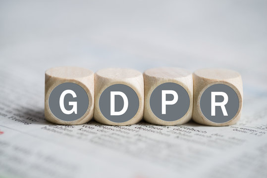 Cubes with abbreviation "GDPR" on a newspaper