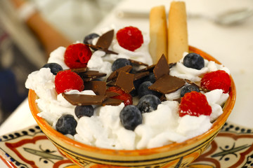 gelato cup Paciugo sundae Portofino, italian ice cream bowl mix whipped cream raspberries blueberries chocolate flakes