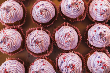 Violet cupcakes at candy bar, closeup