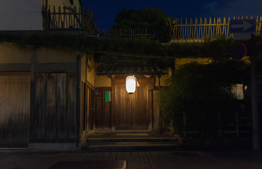 Traditional Japanese house at night, entrance door. Panoramic view